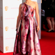 Image for article titled Lots of Red, Charming Crocs, & Strange Headgear at the TV BAFTA Awards